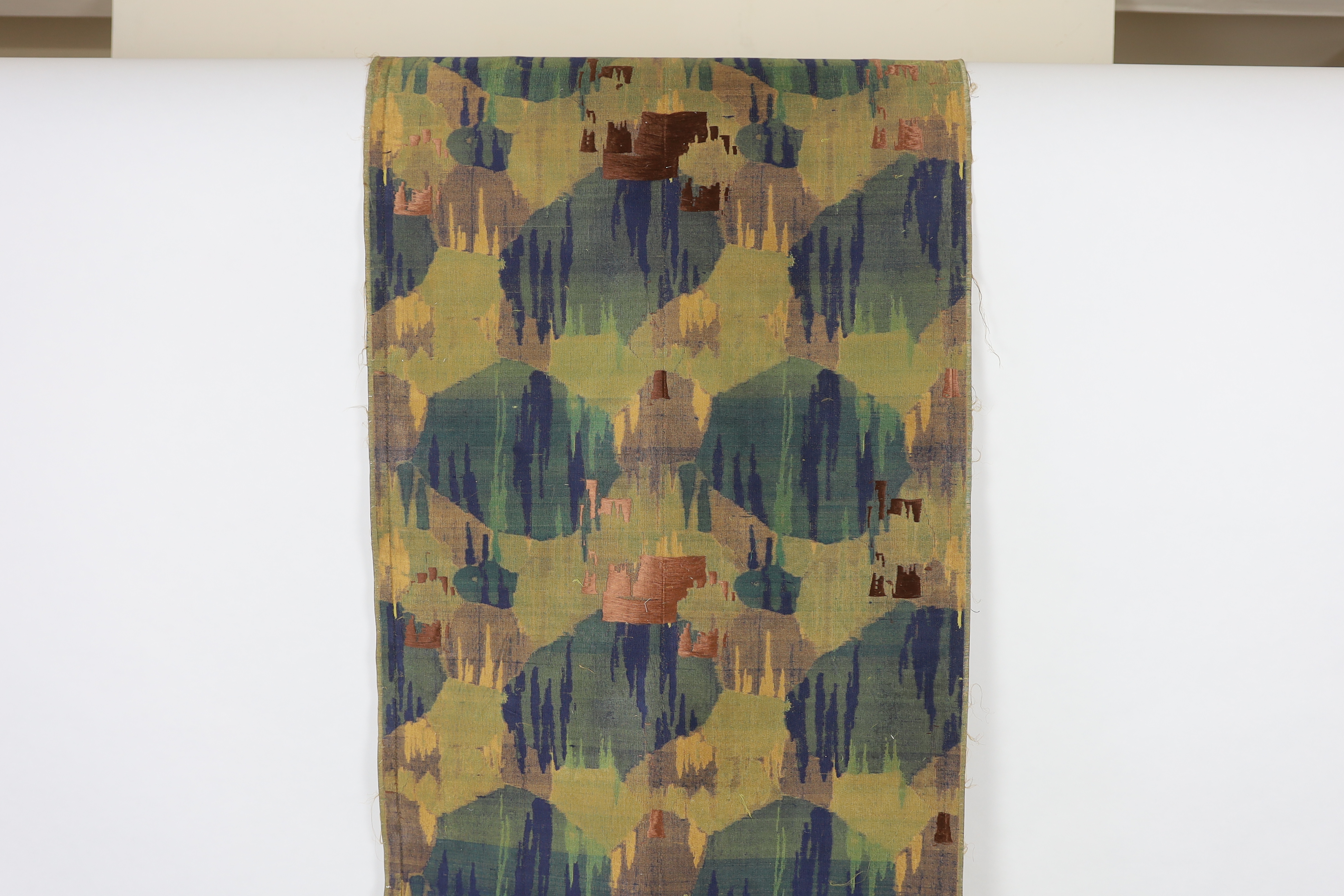 A 1930’s Japanese Kyoto, possibly Nishijin and a Tsumugi hand loomed brocade, woven in fine gold and multi coloured threads, in an abstracted mountainous landscape pattern, originally possibly woven for an Obi, 69cm wide